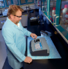 A lab technician performing a turbidity measurement in an industrial lab using the TL2300 laboratory turbidimeter