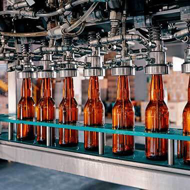 A manufacturing line of glass bottles at a beverage plant is a reminder of how turbidity can effect final taste and quality of products.